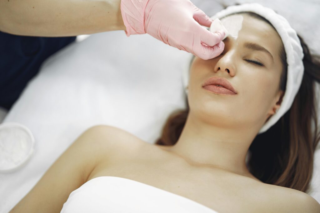 pexels-photo-3985321-3985321 A woman enjoys a soothing facial treatment at a spa, promoting relaxation and skincare.